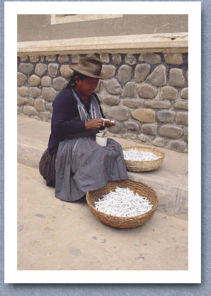 Woman rolling tobacco to make cigarettes, Tarabuco