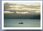 Fisherman rowing out onto lake, Rinihue